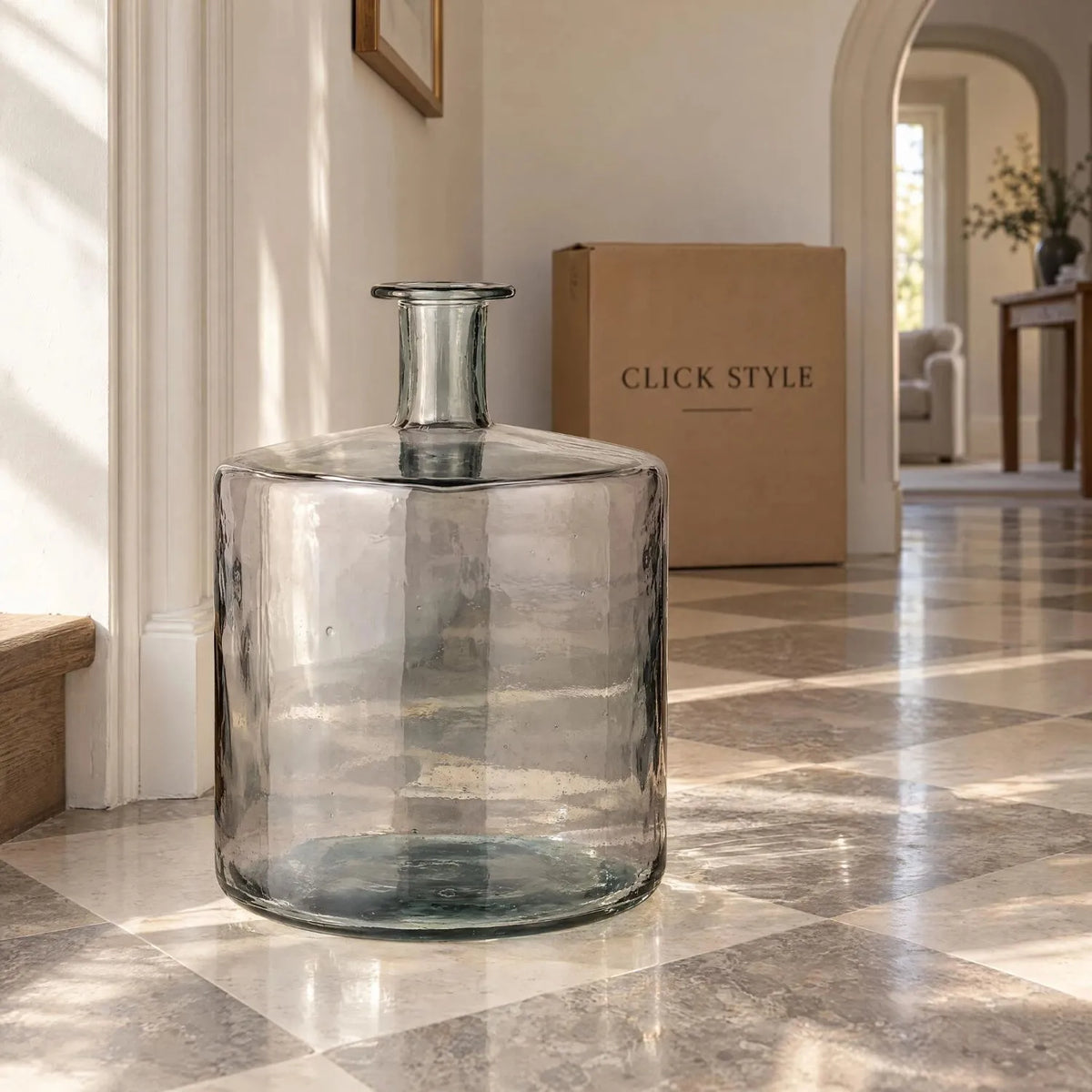 Large Grey Recycled Glass Bottle Vase with Narrow Neck – Wide Decorative Floor Vase 45x35x35cm – Displayed Empty in a Sunlit Hallway with Chequerboard Stone Floor | Click Style