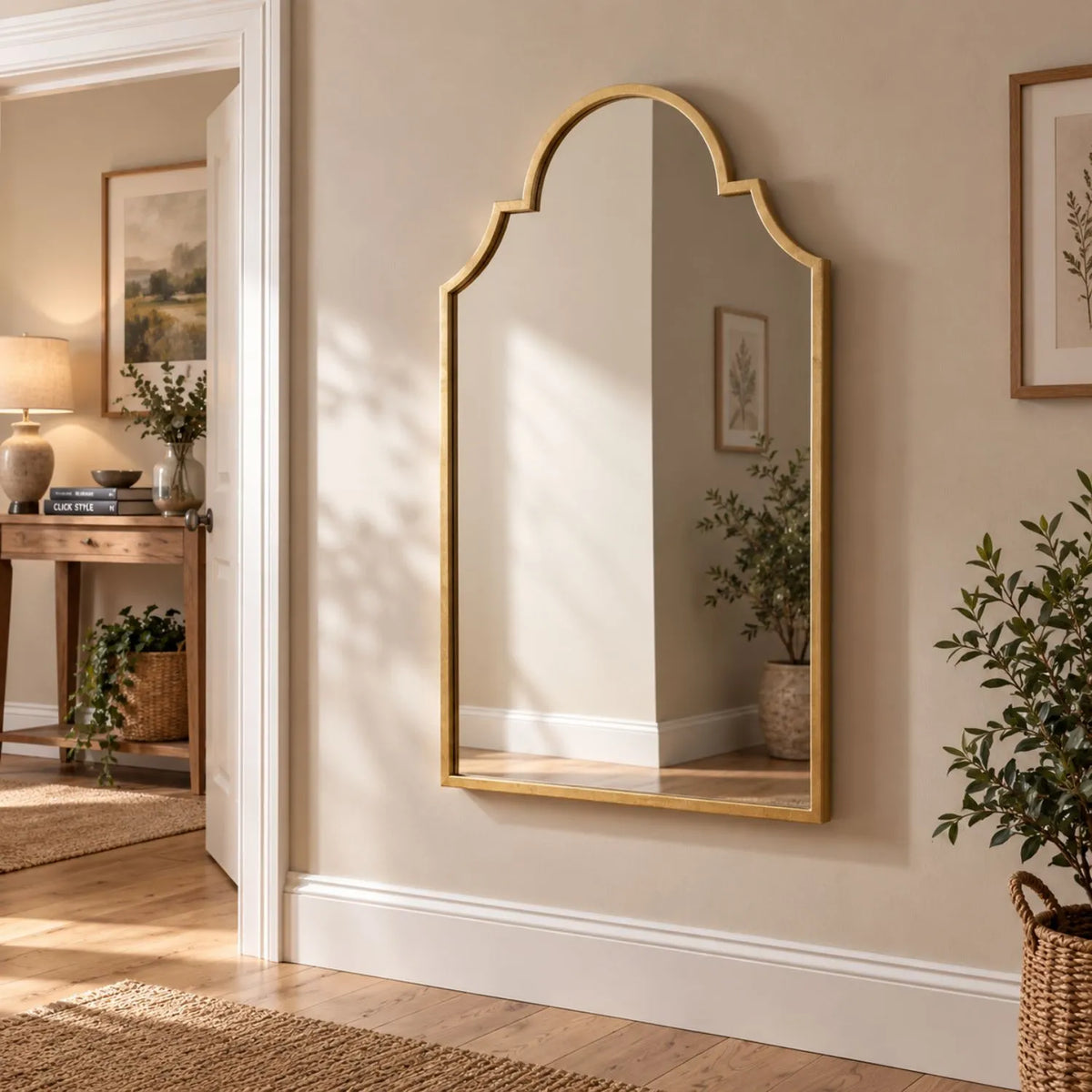 Large Moorish Style Antique Gold Metal Wall Mirror 80x50x2.5cm displayed in warm neutral hallway with plants and artwork | Click Style