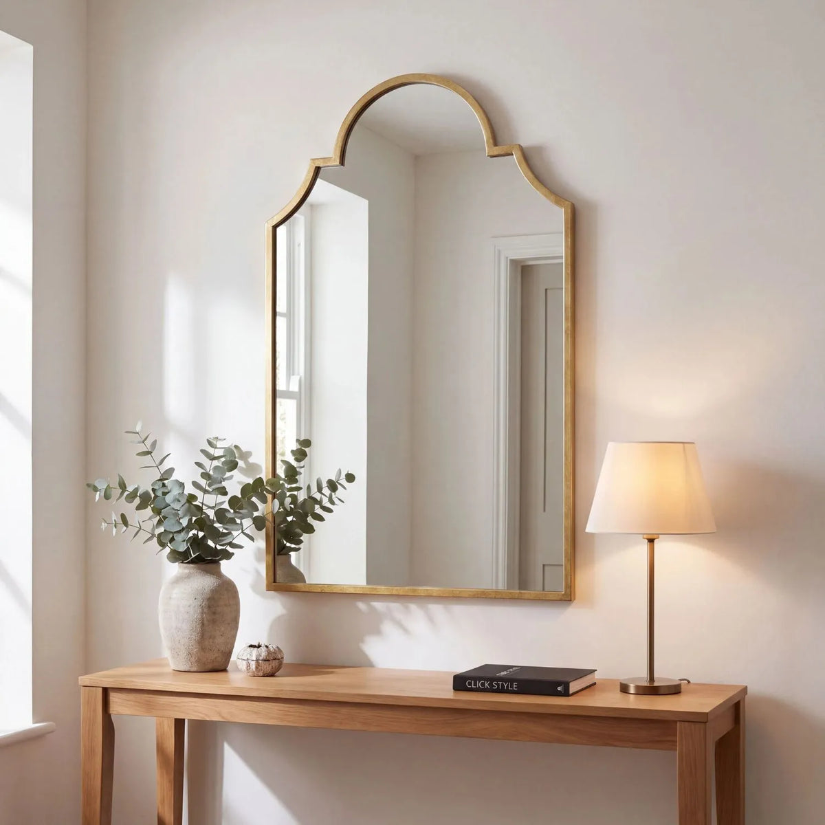 Large Moorish Style Antique Gold Metal Wall Mirror 80x50x2.5cm above console table in contemporary neutral interior | Click Style
