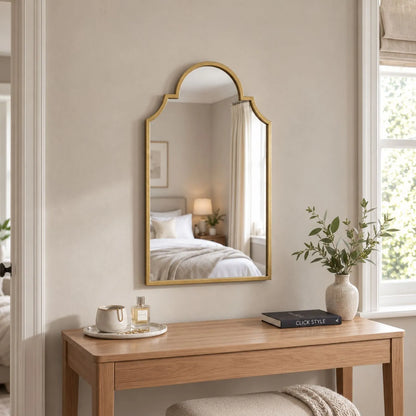 Large Moorish Style Antique Gold Metal Wall Mirror 80x50x2.5cm above wooden dressing table in neutral bedroom | Click Style