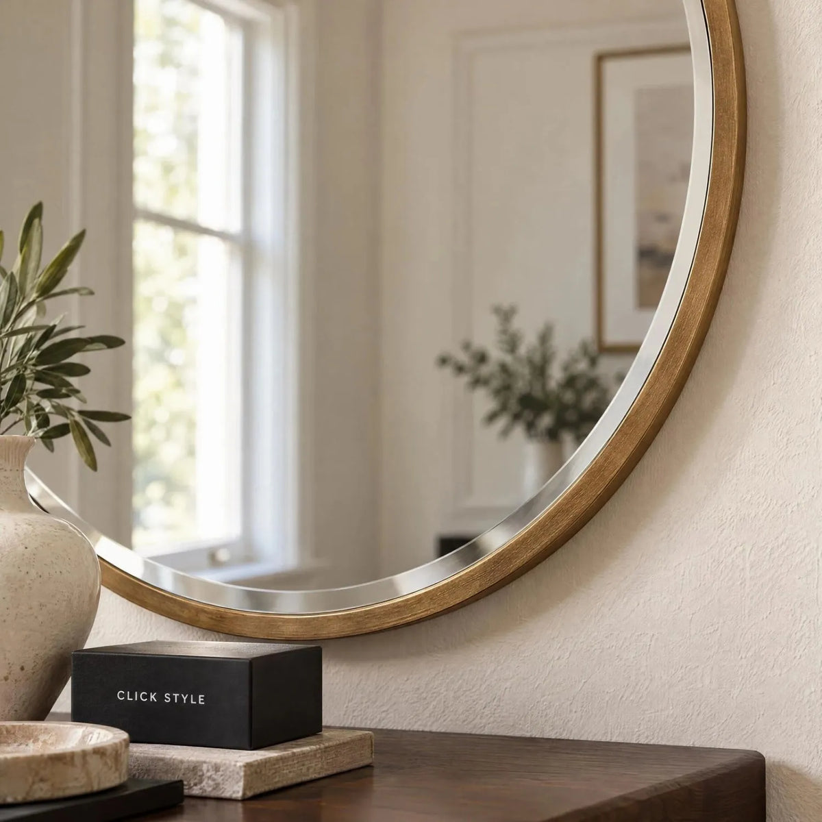 Large Round Antique Gold Wall Mirror with Slim Metal Frame & Bevelled Glass – Decorative Circular Mirror 80x2cm close-up showing textured antique gold metal frame and bevelled glass above a walnut console with CLICK STYLE branding | Click Style