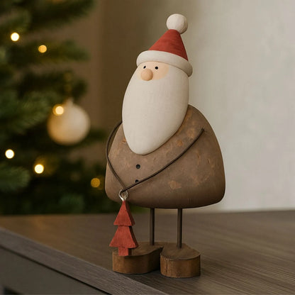 Two rustic wooden & metal Father Christmas ornaments with red hats and tree gifts styled in a modern UK Christmas home | Click Style