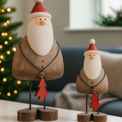 Two rustic wooden & metal Father Christmas ornaments with red hats and tree gifts styled in a modern UK Christmas home | Click Style