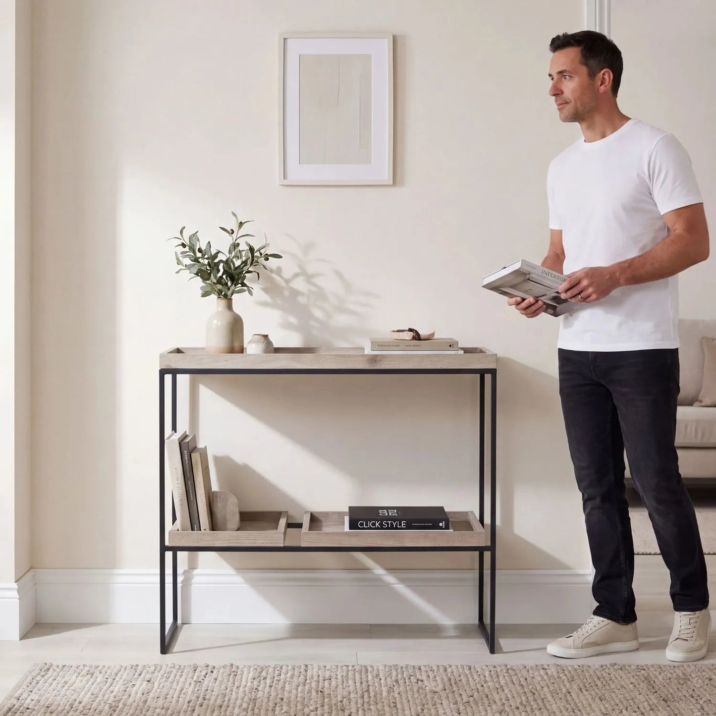 Natural Wood Effect Veneer 2 Shelf Display Unit with 3 Trays & Black Metal Frame styled in a contemporary home with man | Click Style