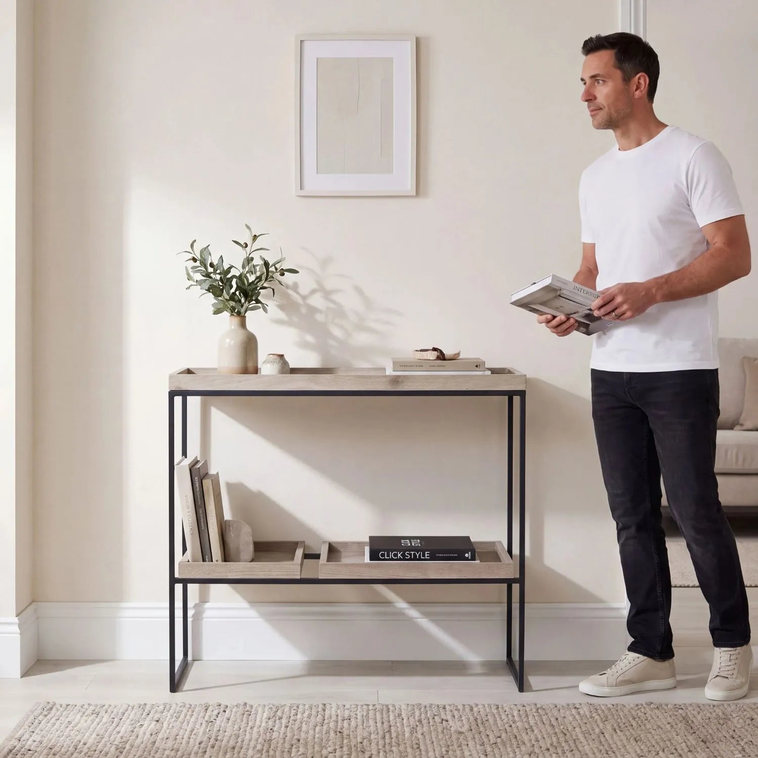 Natural Wood Effect Veneer 2 Shelf Display Unit with 3 Trays & Black Metal Frame styled in a contemporary home with man | Click Style