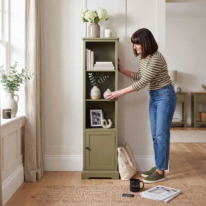 Olive Green Pine Wood 1 Door 3 Shelf Display Storage Unit with Matt Black Door Knob styled in a modern country home with a woman arranging home décor 153x38x30cm | Click Style