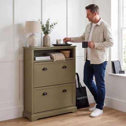 Olive Green Pine Wood 2 Drawer Shoe Storage Unit with Matt Black Cup Handles styled in a modern country hallway with a man holding a  mug beside the cabinet 106x80x28cm | Click Style