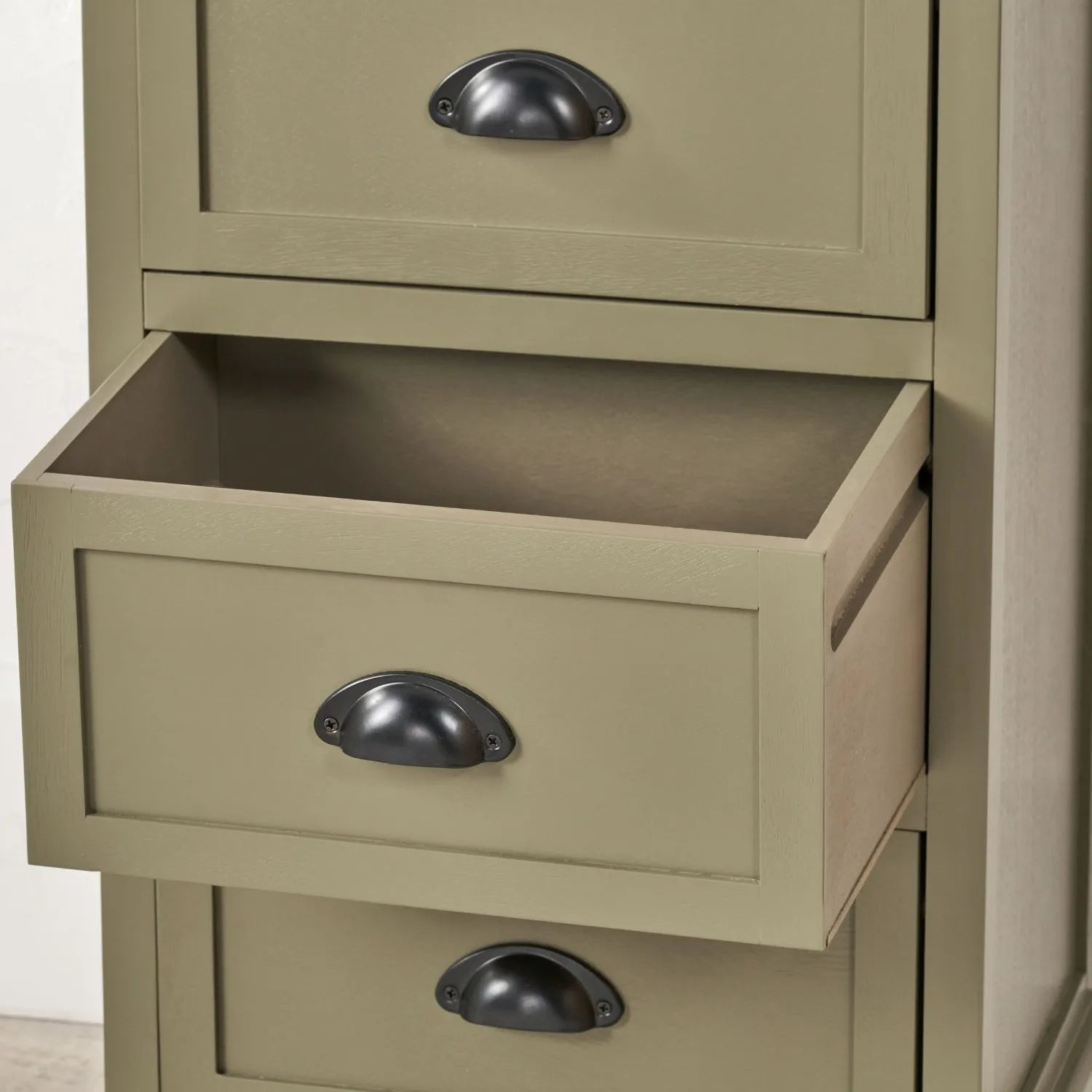 Olive Green Pine Wood 5 Drawer Tall Boy Chest of Drawers Lifestyle Close Up Showing Second Bottom Drawer Open with Matt Black Cup Handles | Click Style