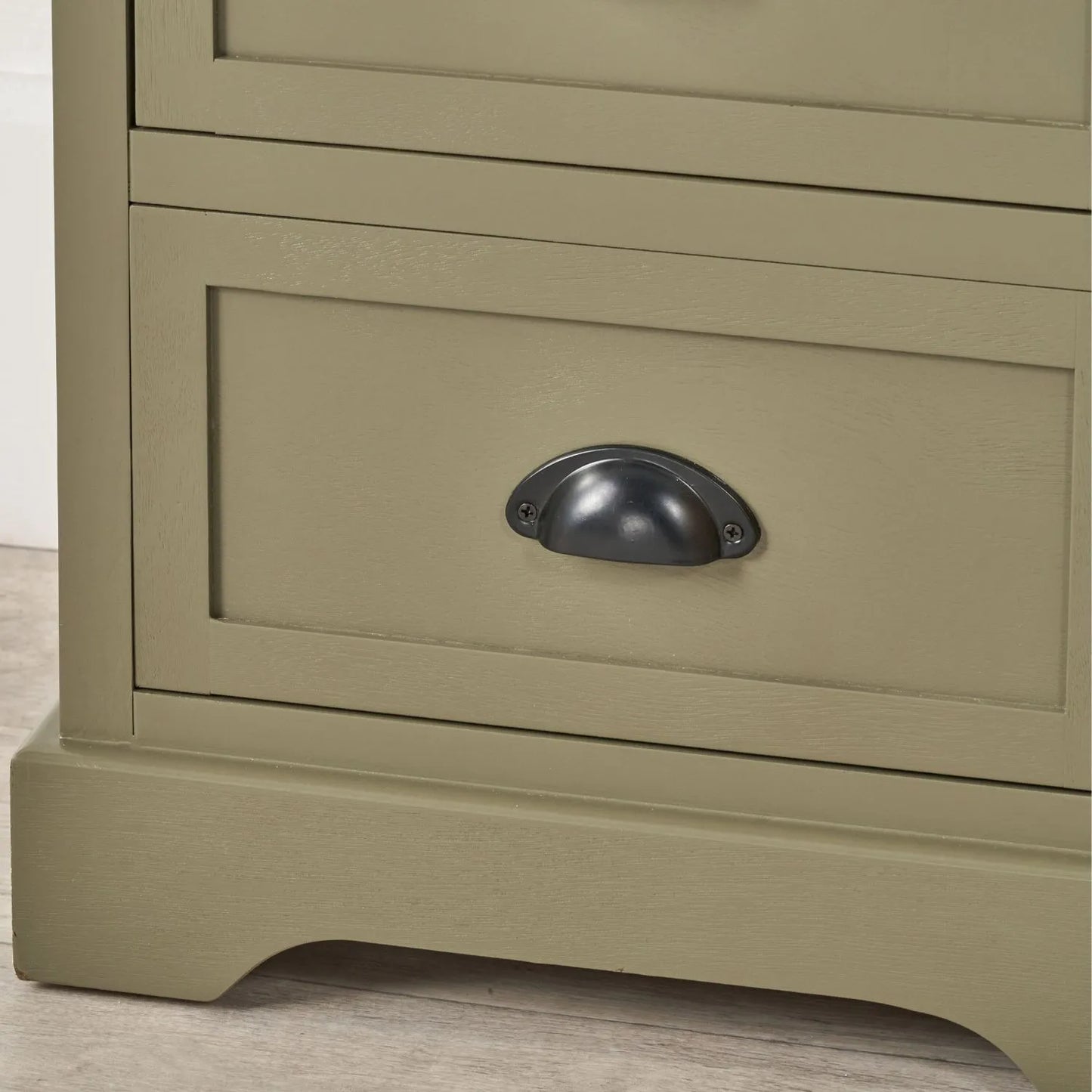 Olive Green Pine Wood 5 Drawer Tall Boy Chest of Drawers Lifestyle Close Up Showing Bottom Right Corner Plinth Base and Matt Black Cup Handle | Click Style
