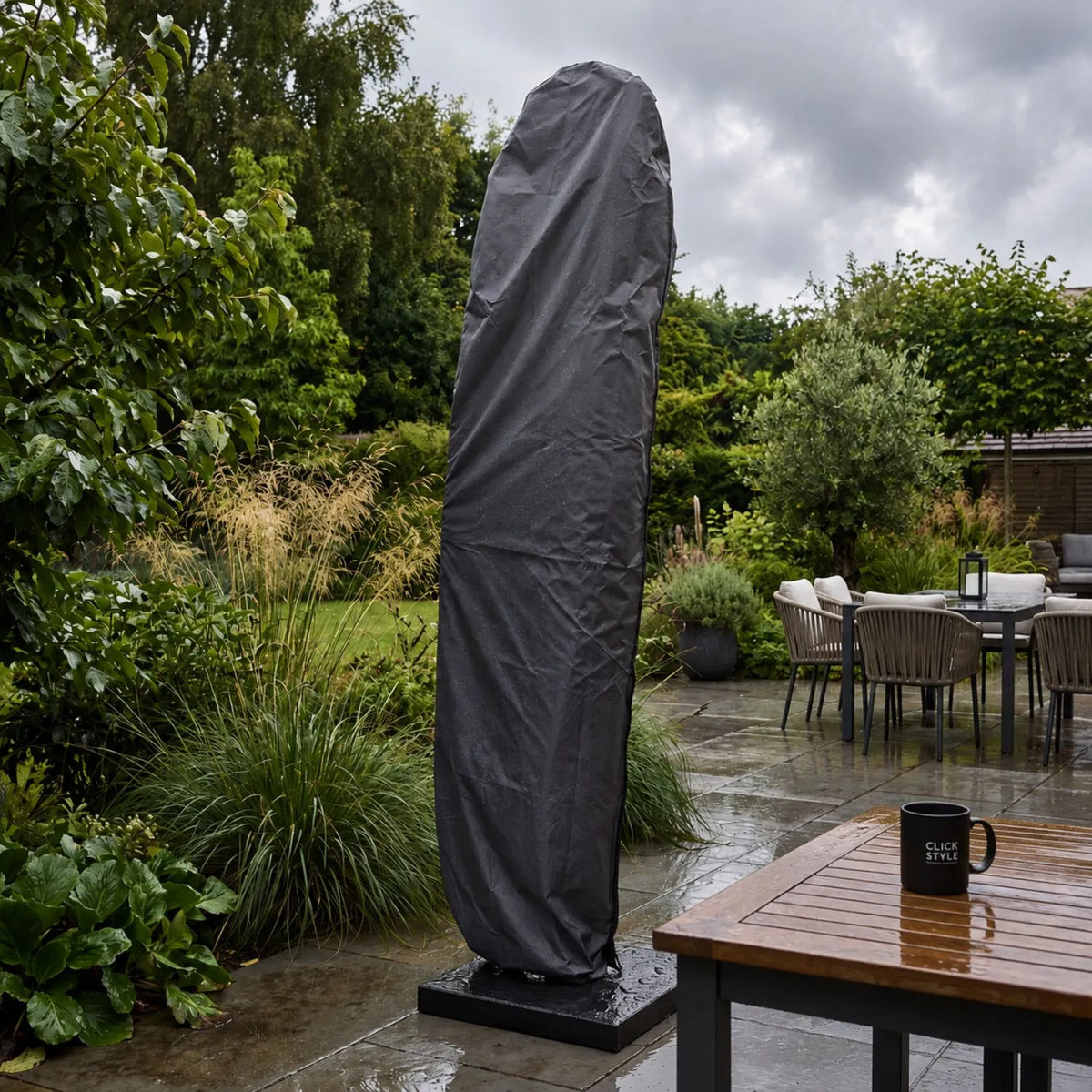 Platinum AeroCover anthracite grey cantilever parasol cover protecting closed parasol in wet British weather | Click Style
