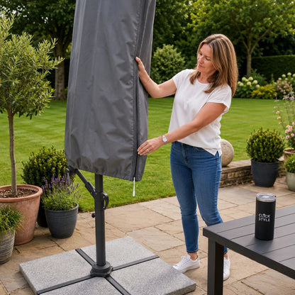 Platinum AeroCover anthracite grey cantilever parasol cover with sewn-in fibreglass fitting rod in use | Click Style