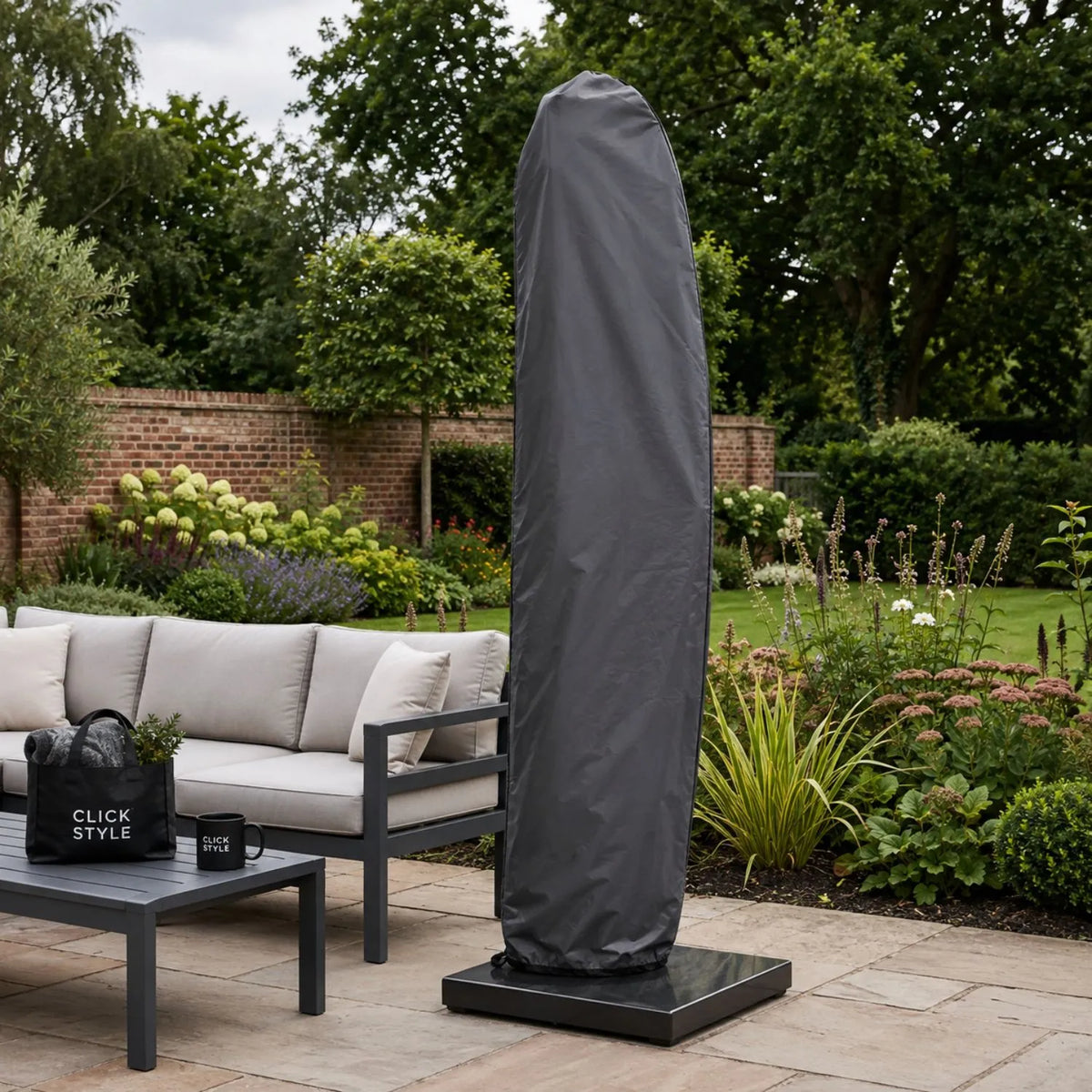 Platinum AeroCover anthracite grey cantilever parasol cover fitted over closed free arm parasol in UK garden | Click Style