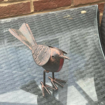 Rustic Brown & Red Metal Robin Ornament with Weathered Finish – Handcrafted Decorative Robin Redbreast Bird 11x17x6cm – Customer Image Displayed on Glass Garden Table | Click Style