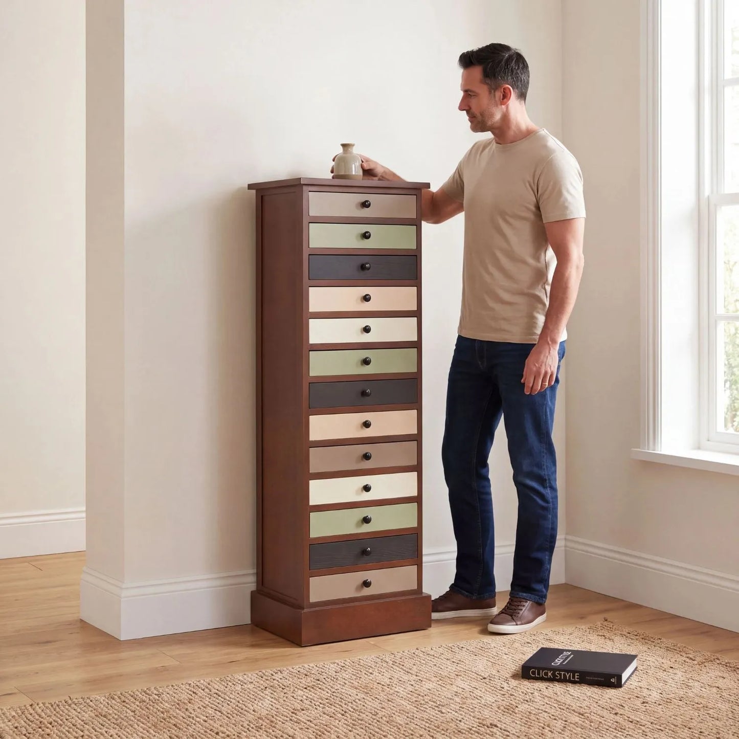 Sage Green & Neutral Pine Wood 13 Drawer Tallboy Chest with Black Knob Handles styled with man in neutral interior | Click Style