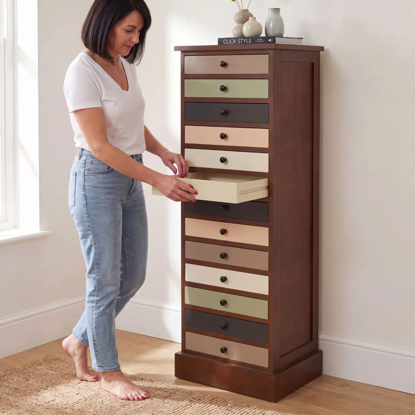 Sage Green & Neutral Pine Wood 13 Drawer Tallboy Chest with Black Knob Handles with woman opening drawer | Click Style
