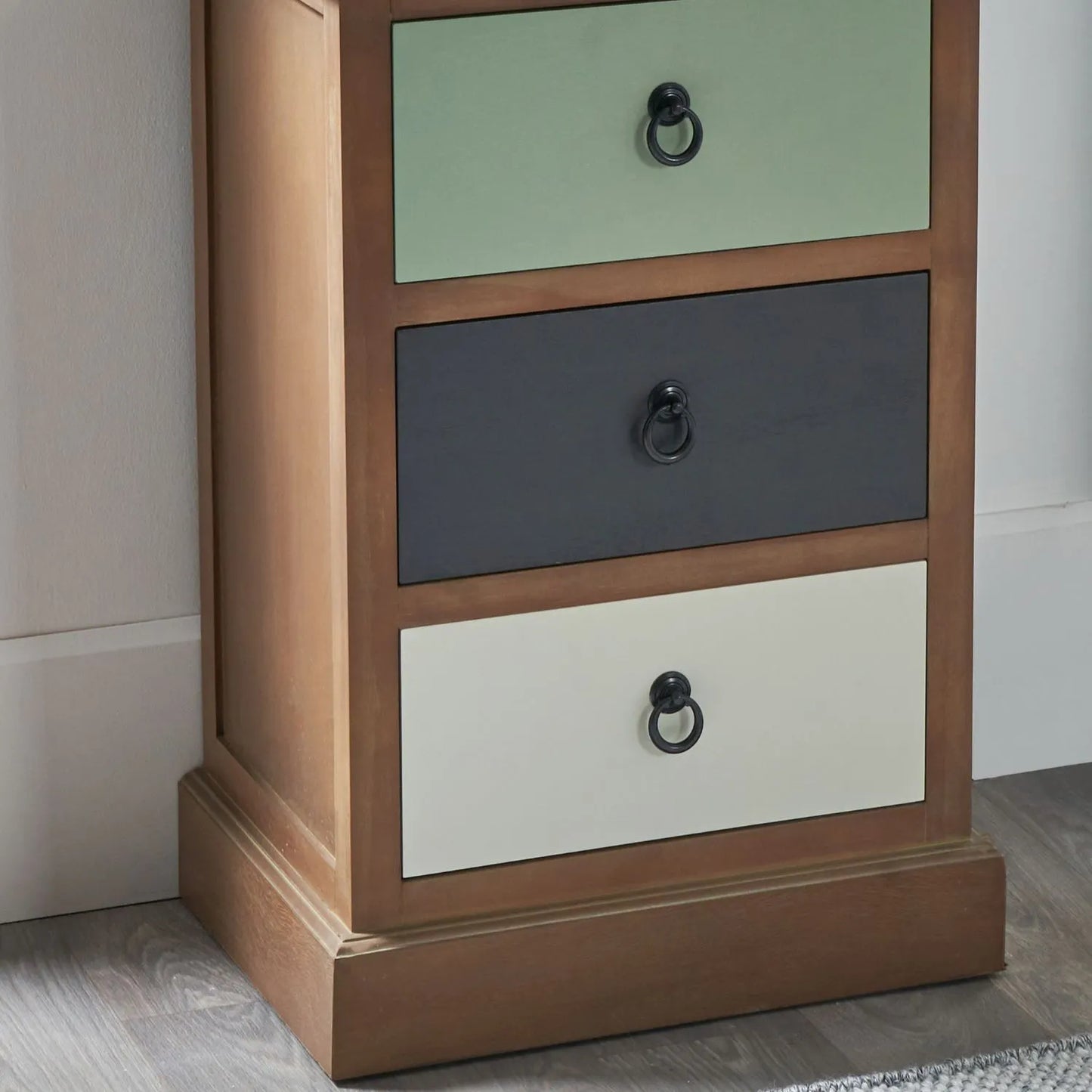 Sage green and neutral pine wood 3 drawer side table and bedside table close-up showing drawers, black ring handles and bottom plinth | Click Style