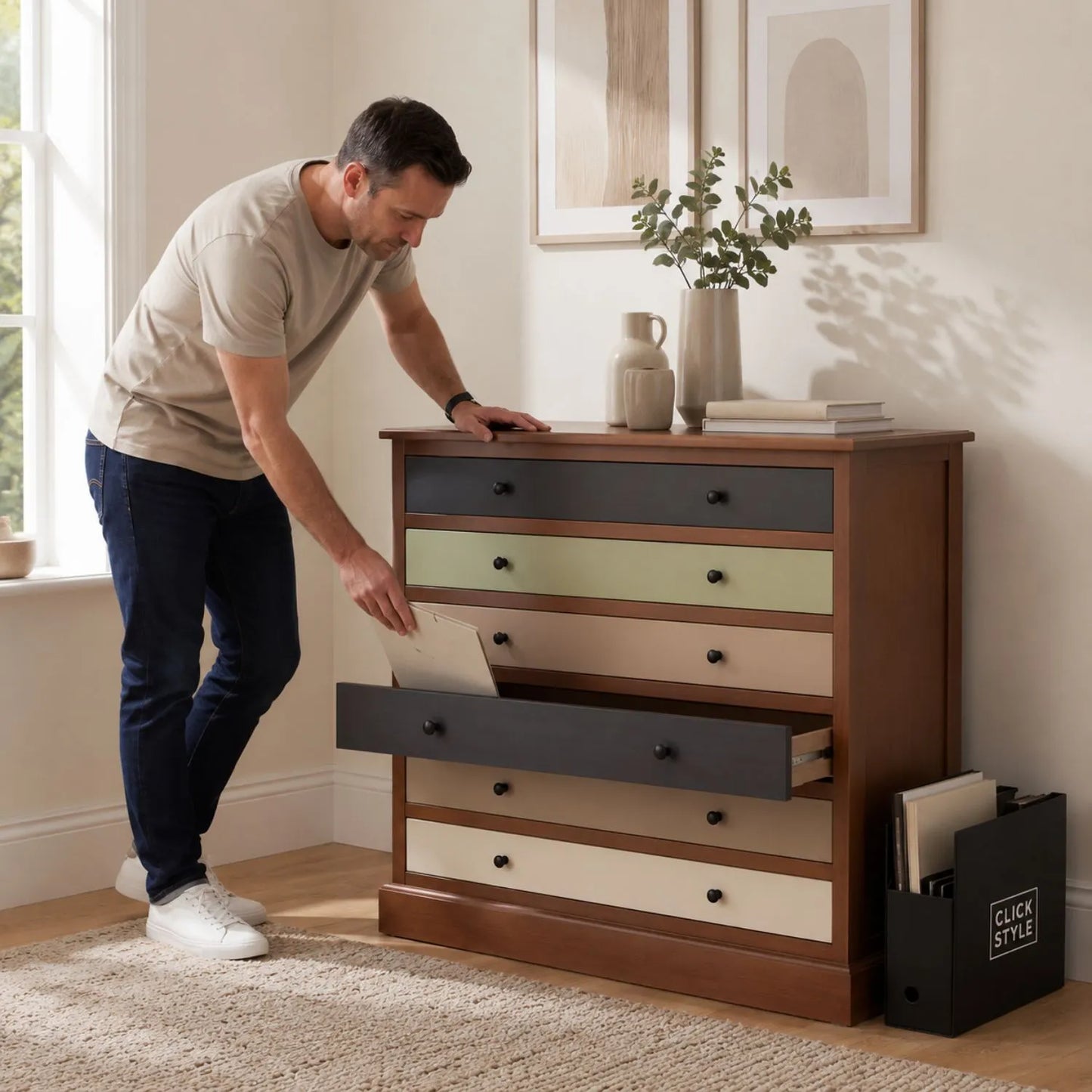 Sage Green & Neutral Pine Wood 6 Drawer Chest with Black Knob Handles styled in a neutral interior with man | Click Style