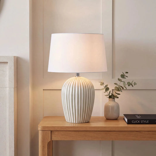 Sage Green & White Striped Ceramic Table Lamp with White Cotton Tapered Shade – Ribbed Bulbous Base Bedside Light 45x30x30cm styled with light on on a natural wood console table in a warm neutral interior | Click Style
