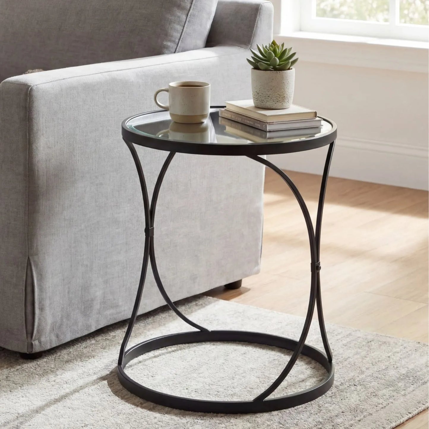 Set of 2 Black Metal Round Nesting Side Tables with Mirrored Glass Tops, Sculptural Curved Open Frame Design and Space Saving Nesting Layout – Contemporary Sofa End Lamp Tables for Living Room Lounge or Bedroom 58x51x51cm | Click Style