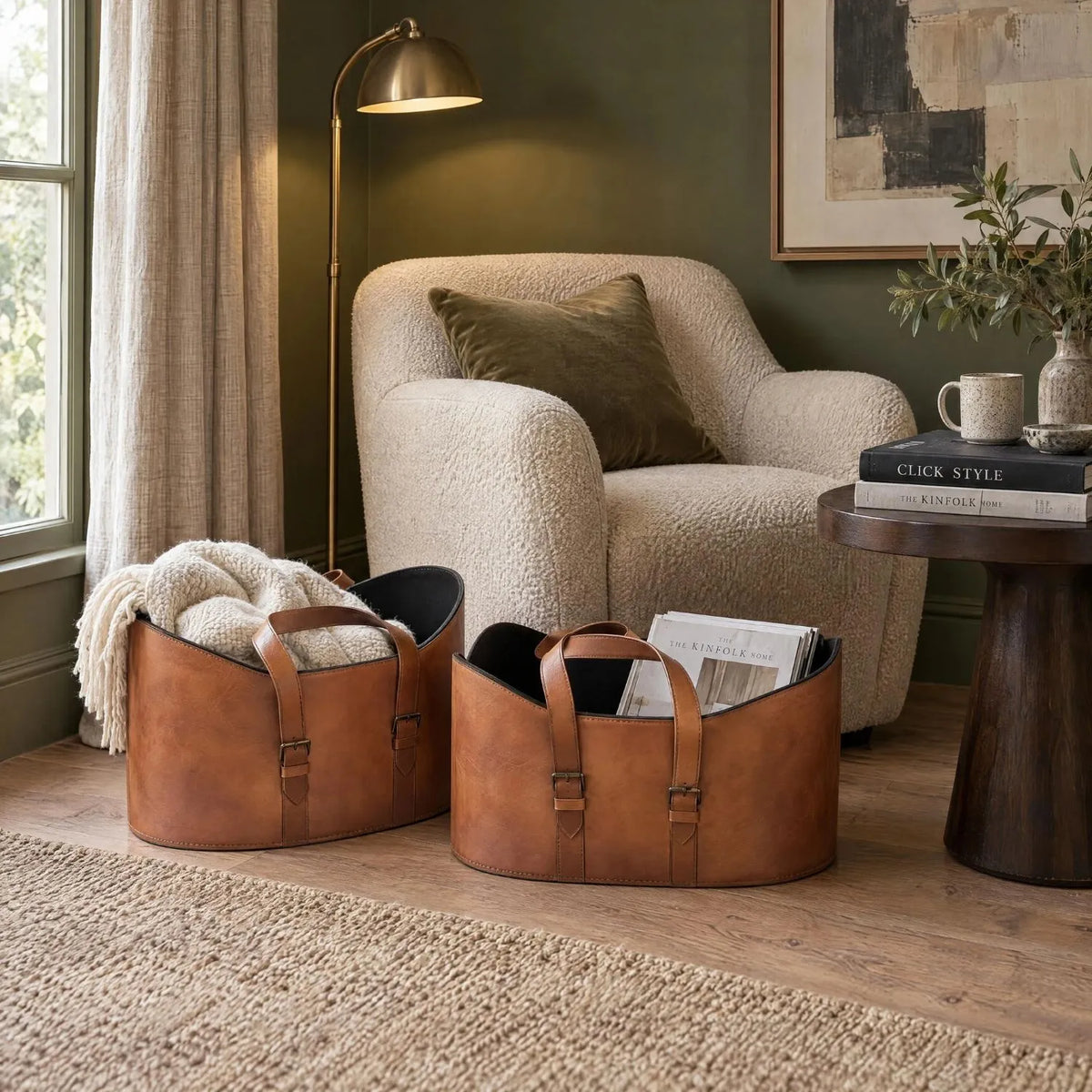 Set of Two Light Brown Leather Storage Baskets with Carry Handles & Buckle Straps – Sculptural Storage Bins 34x50x40cm Styled in Reading Room with Armchair | Click Style