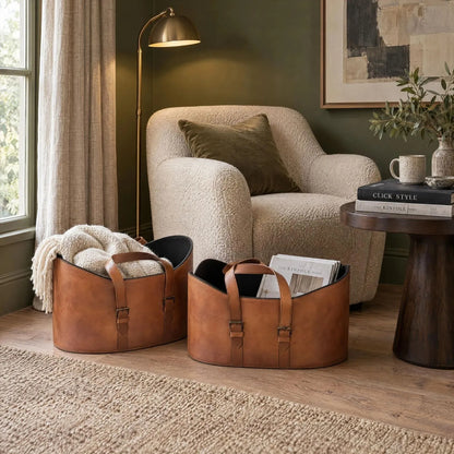 Set of Two Light Brown Leather Storage Baskets with Carry Handles & Buckle Straps – Sculptural Storage Bins 34x50x40cm Styled in Reading Room with Armchair | Click Style