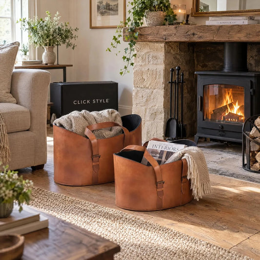 Set of Two Light Brown Leather Storage Baskets with Carry Handles & Buckle Straps – Sculptural Storage Bins 34x50x40cm Styled Beside Wood-Burning Stove & Fireplace | Click Style