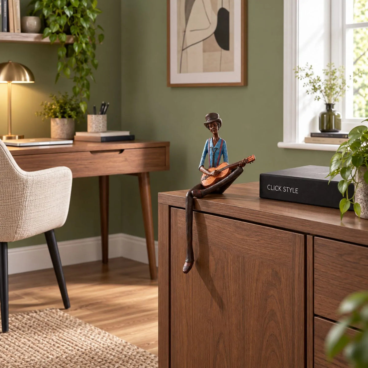 Shelf-Sitter Jazz Guitarist Resin Ornament – Sitting Musician Sculpture 42x17x11cm – Styled on Dark Wood Cabinet in Contemporary Sage Green Home Study | Click Style