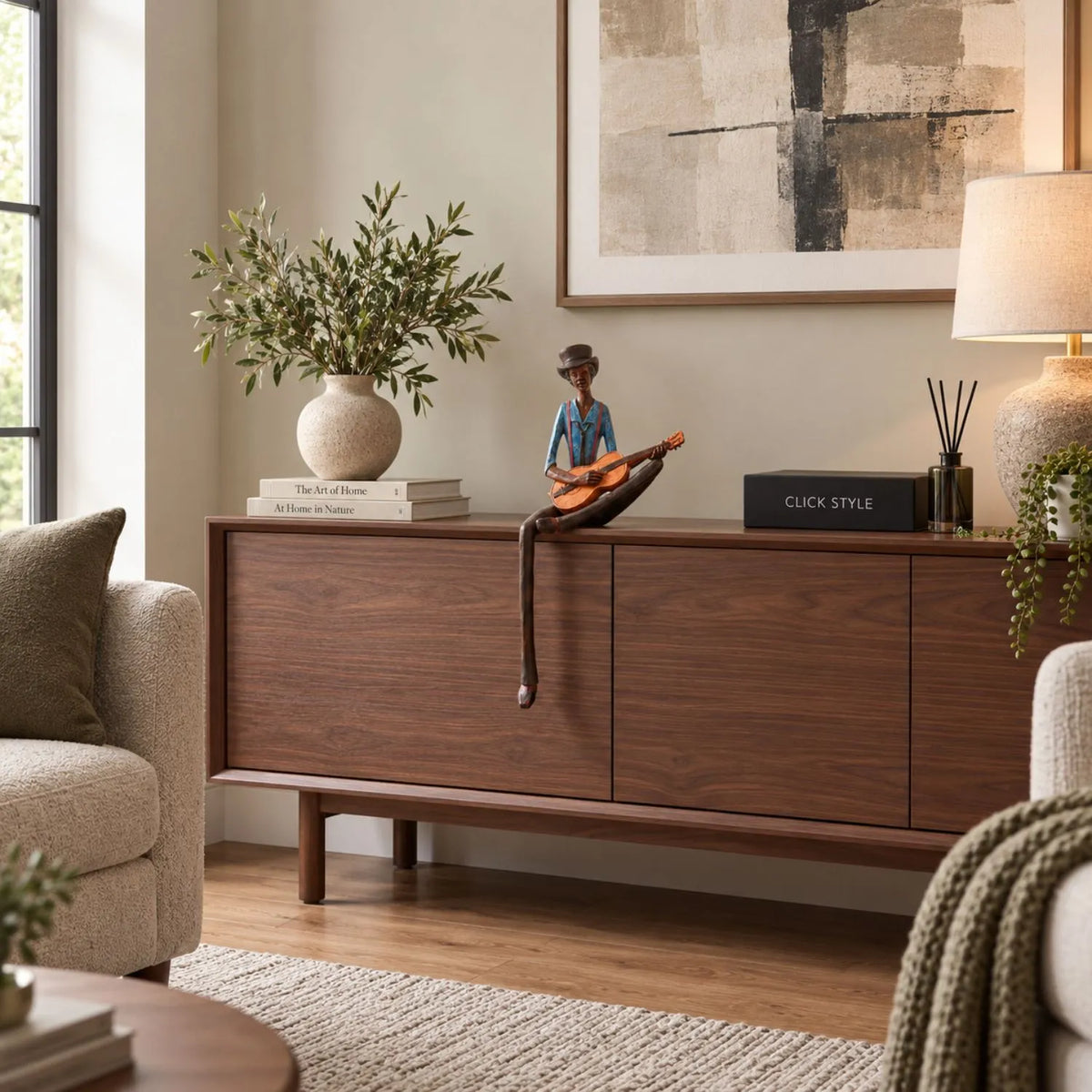Shelf-Sitter Jazz Guitarist Resin Ornament – Sitting Musician Sculpture 42x17x11cm – Styled on Dark Walnut Sideboard in Contemporary Living Room | Click Style
