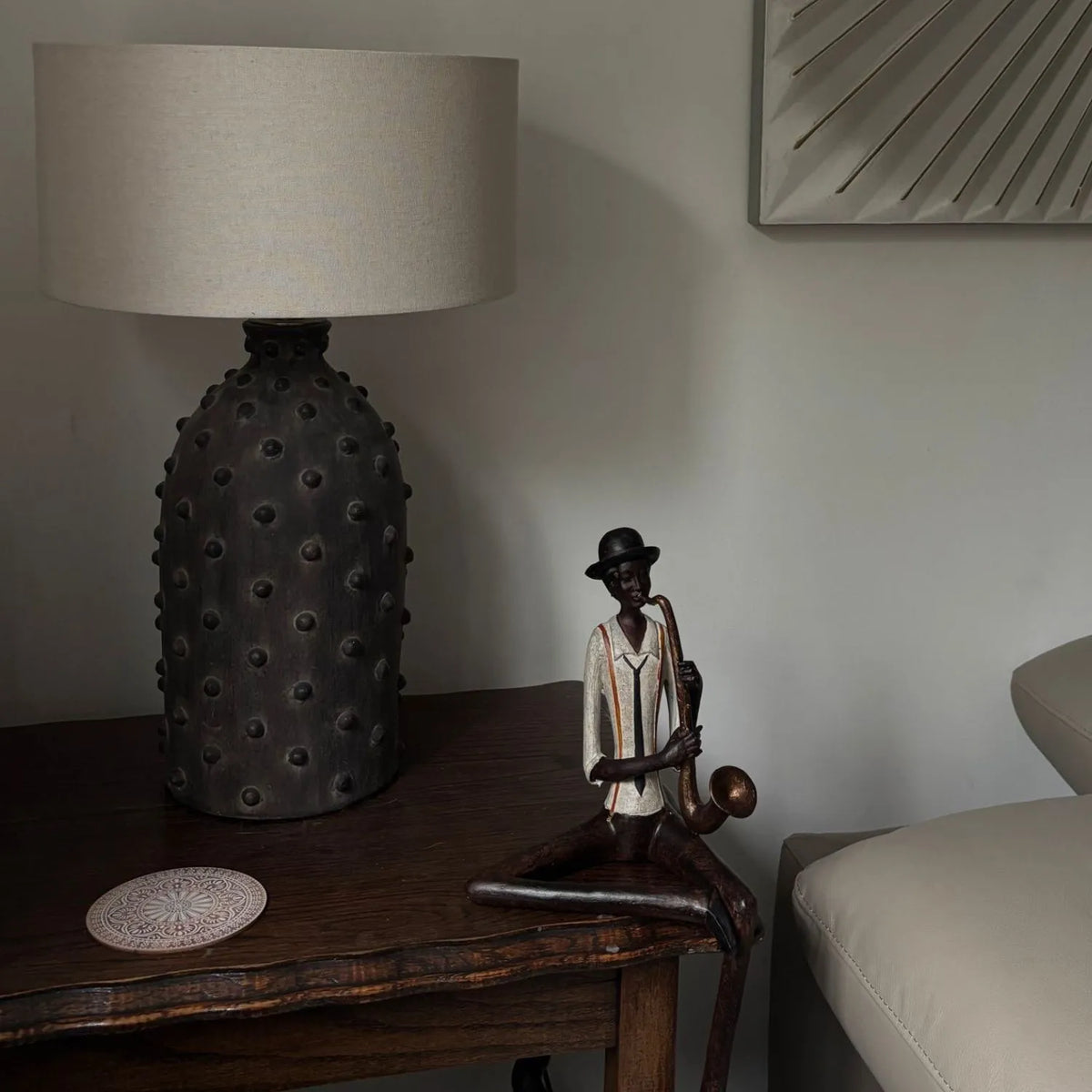 Shelf-Sitter Jazz Saxophonist Resin Ornament displayed on side table in real customer's home | Click Style
