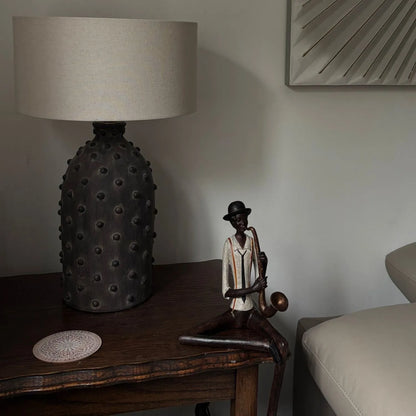 Shelf-Sitter Jazz Saxophonist Resin Ornament displayed on side table in real customer's home | Click Style