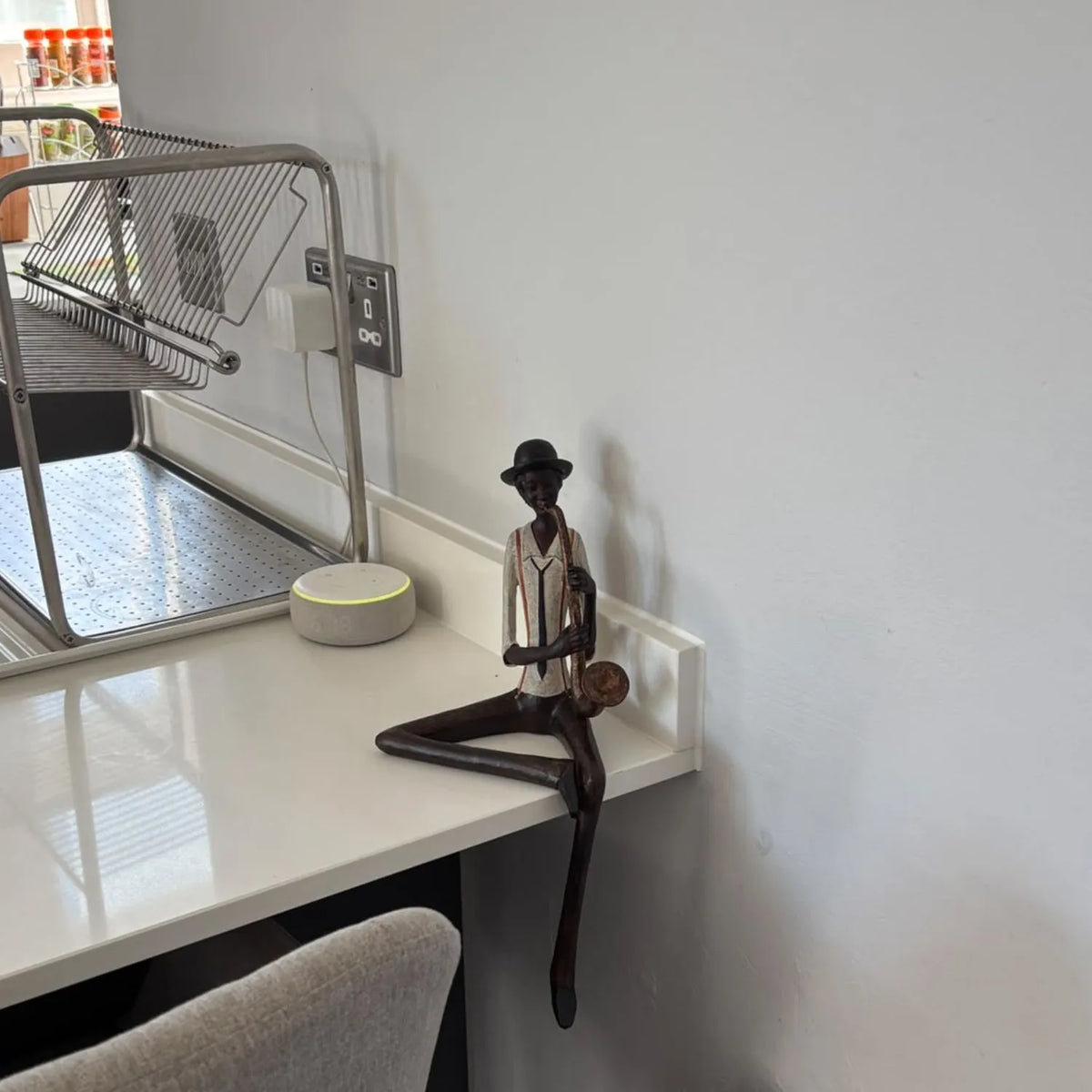 Shelf-Sitter Jazz Saxophonist Resin Ornament – Sitting Musician Sculpture 38x17x11cm – styled on a desk in a real customer’s home | Click Style