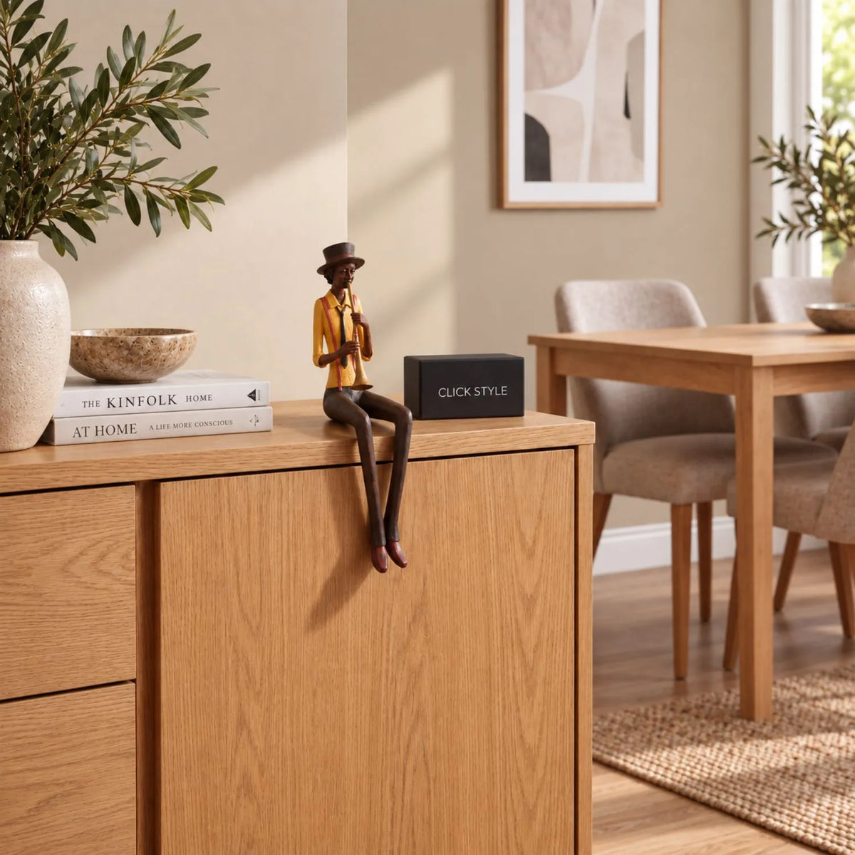 Shelf-Sitter Jazz Trumpeter Resin Ornament – Sitting Musician Sculpture Styled on Natural Oak Sideboard in Contemporary Dining Room 39x12x10cm | Click Style