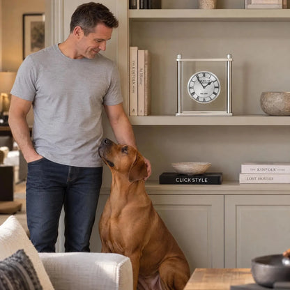Silver Metal & Glass Table Mantel Clock with Floating Clock Face Roman Numerals & Black Hands 28x25x7cm styled on built-in shelving with man and Rhodesian Ridgeback | Click Style