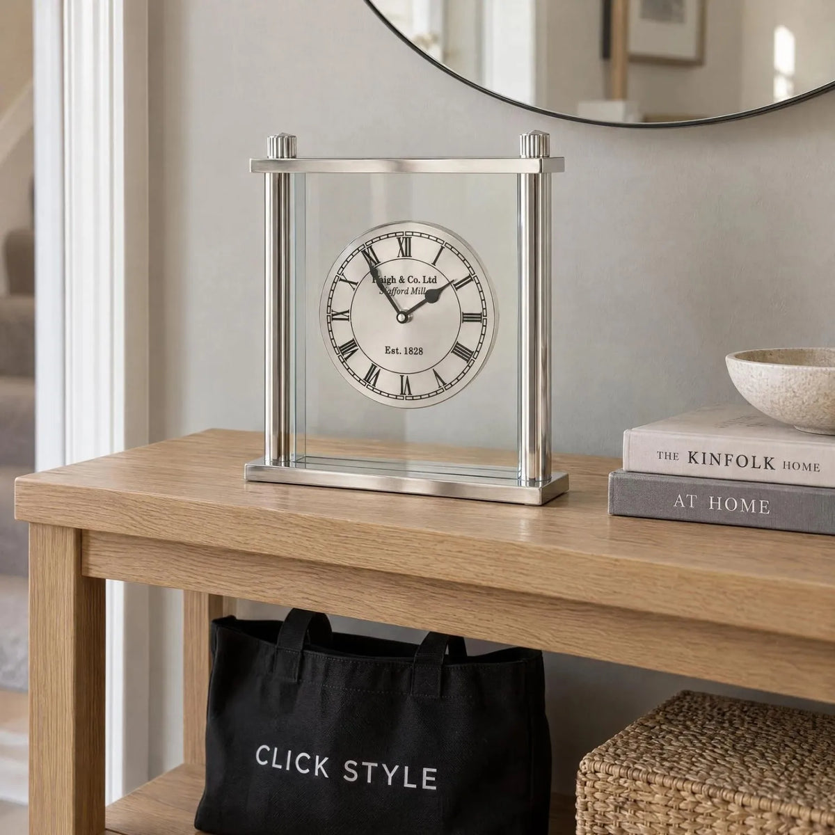 Silver Metal & Glass Table Mantel Clock with Floating Clock Face Roman Numerals & Black Hands 28x25x7cm styled on a light oak console table with Click Style tote bag | Click Style