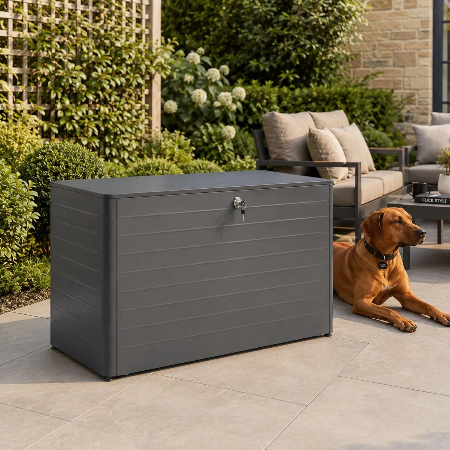 Small Anthracite Grey Galvanised Steel Outdoor Cushion Storage Box with Lockable Lid styled in a contemporary garden with Rhodesian Ridgeback beside it 78x134x62cm | Click Style