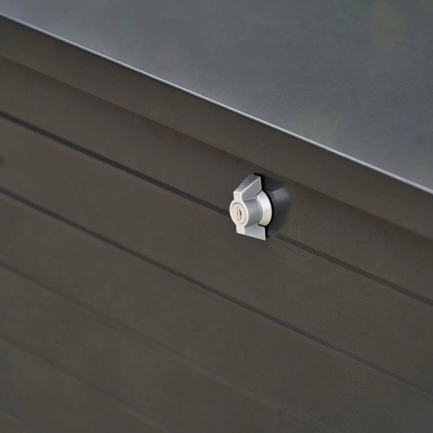 Small Black Galvanised Steel Outdoor Cushion Storage Box close-up angled left showing lock detail | Click Style