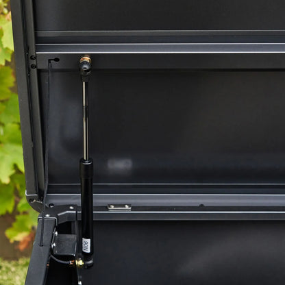 mall Black Galvanised Steel Outdoor Cushion Storage Box lifestyle close-up of left side with open lid showing lid connection and gas piston | Click Style