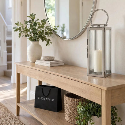 Small Polished Silver Nickel Candle Lantern with Ribbed Glass Panels & Curved Carry Handle – Decorative Stainless Steel Lantern 43x19x17cm displayed on a light oak hallway console table beneath a round mirror beside a cream vase with green foliage | Click Style