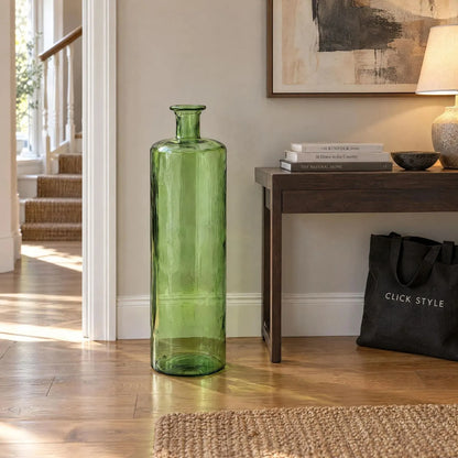 Tall Forest Green Recycled Glass Bottle Vase with Narrow Neck – Large Decorative Floor Standing Vase 75x25x25cm – Displayed Empty Beside Dark Wood Console Table | Click Style