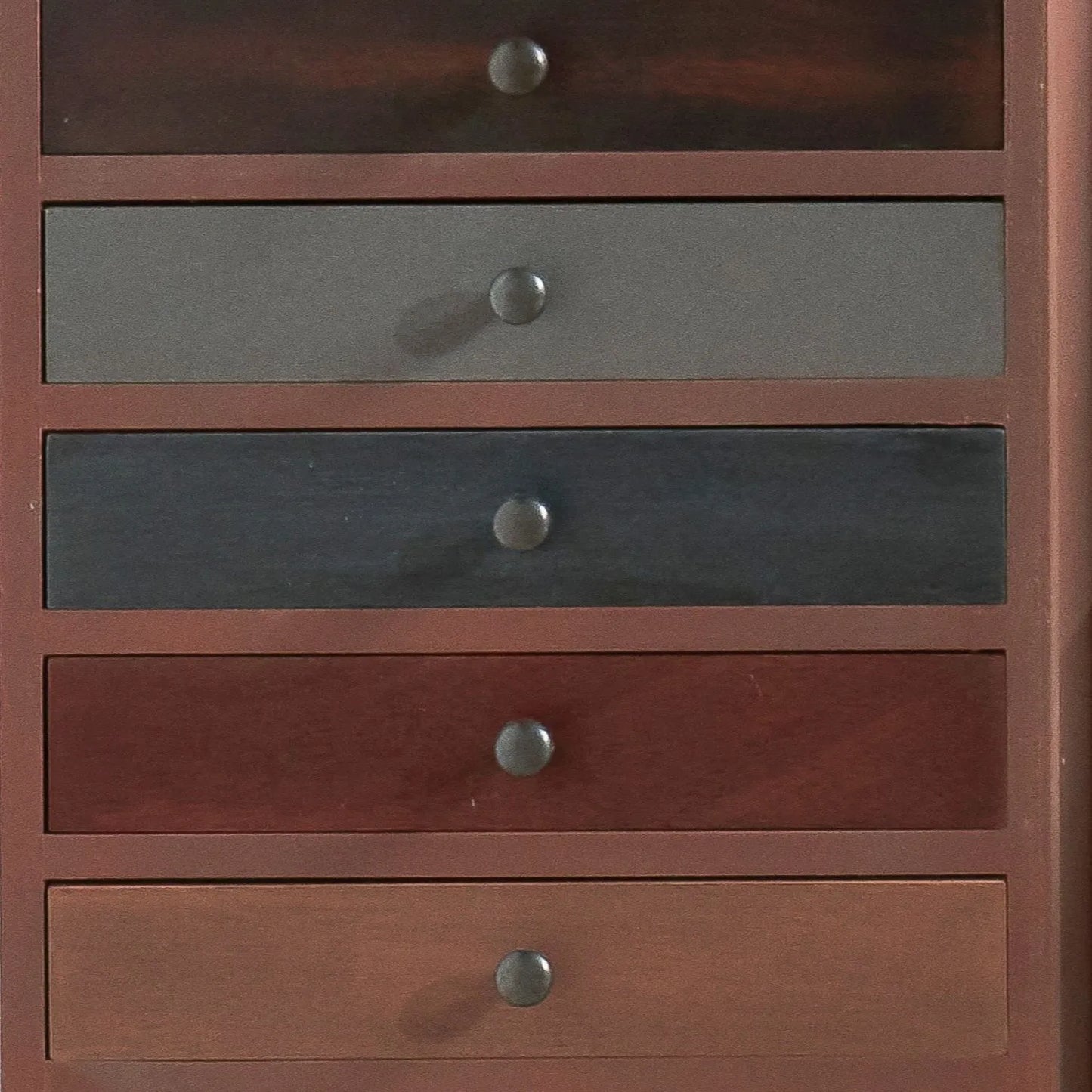 Turquoise blue and neutral distressed pine wood 13 drawer tallboy chest close-up front view of five lower drawers with black knob handles | Click Style