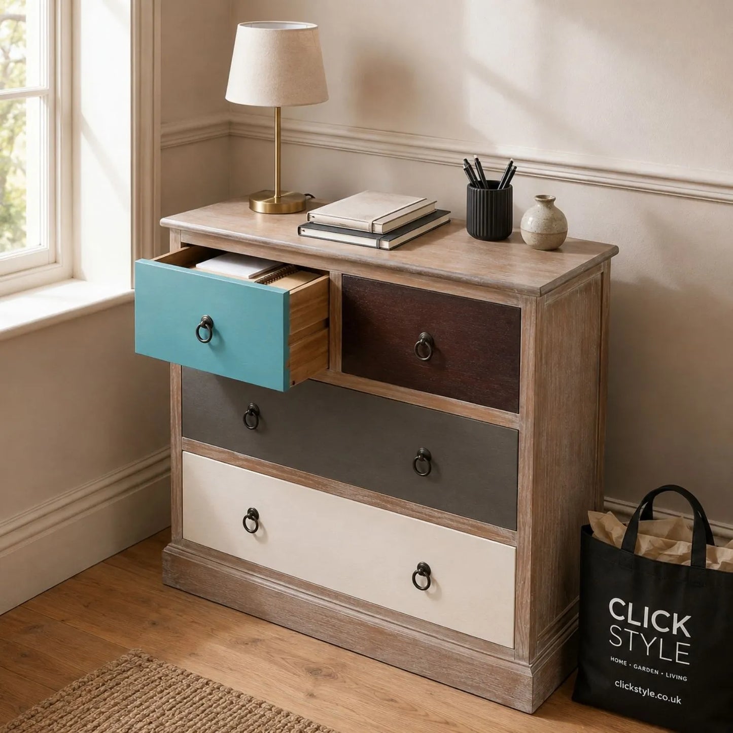 Turquoise Blue & Neutral Distressed Pine Wood 4 Drawer Chest with Black Ring Handles styled in a home office with turquoise drawer open | Click Style