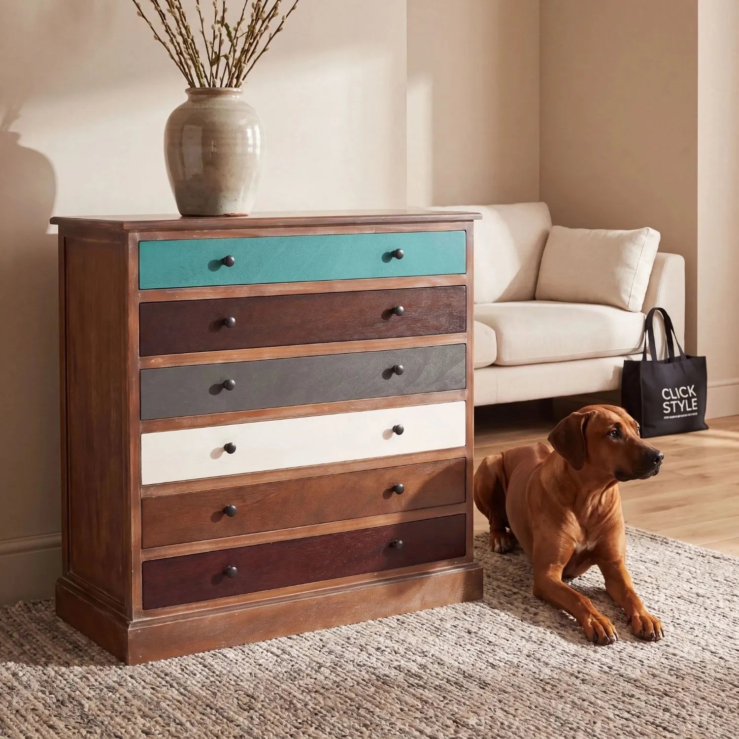 Turquoise blue and neutral distressed pine wood 6 drawer chest with black knob handles styled in a living room with Rhodesian Ridgeback | Click Style