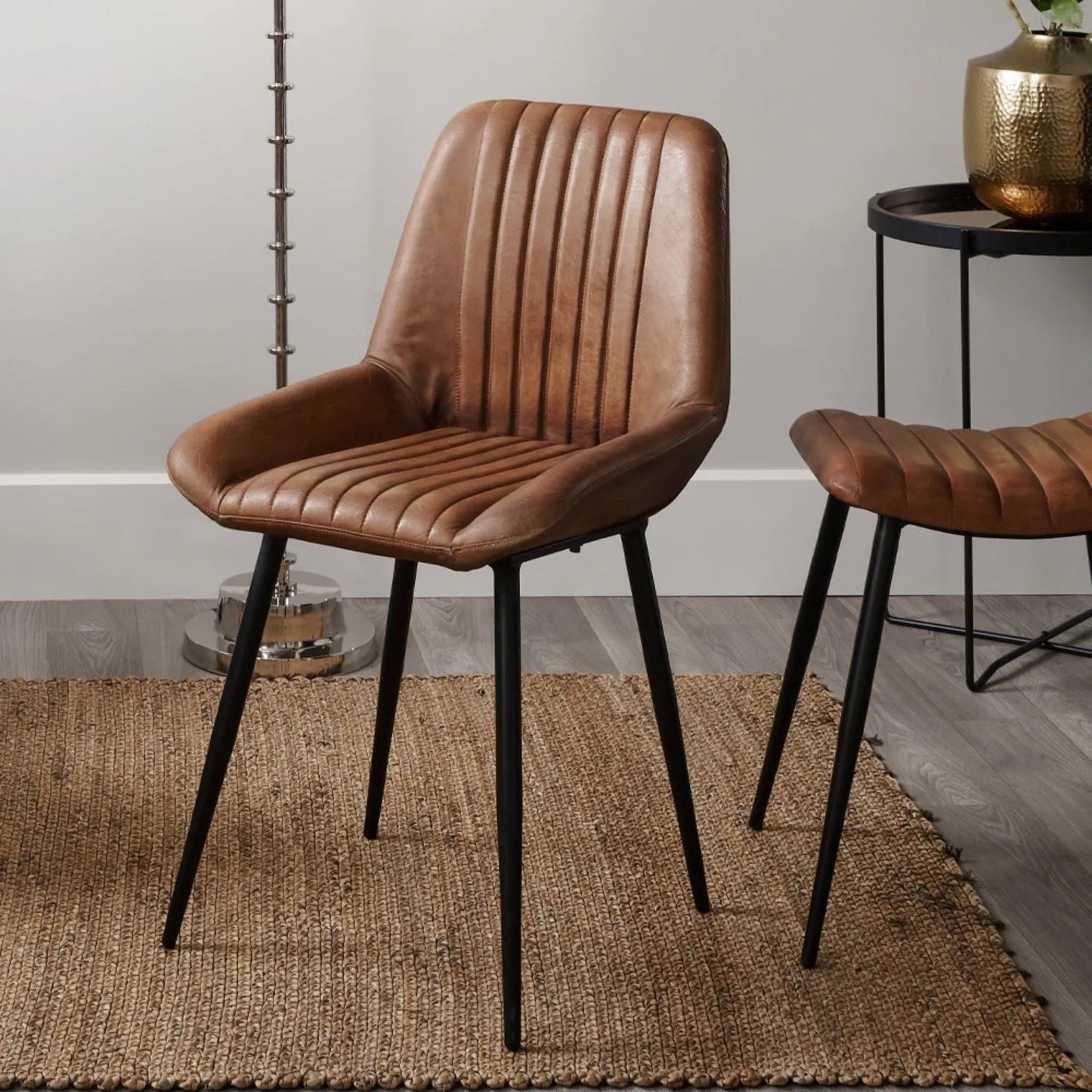 Vintage brown genuine leather dining chair with channel-stitched ribbed upholstery and interchangeable black and bronze metal legs | Click Style