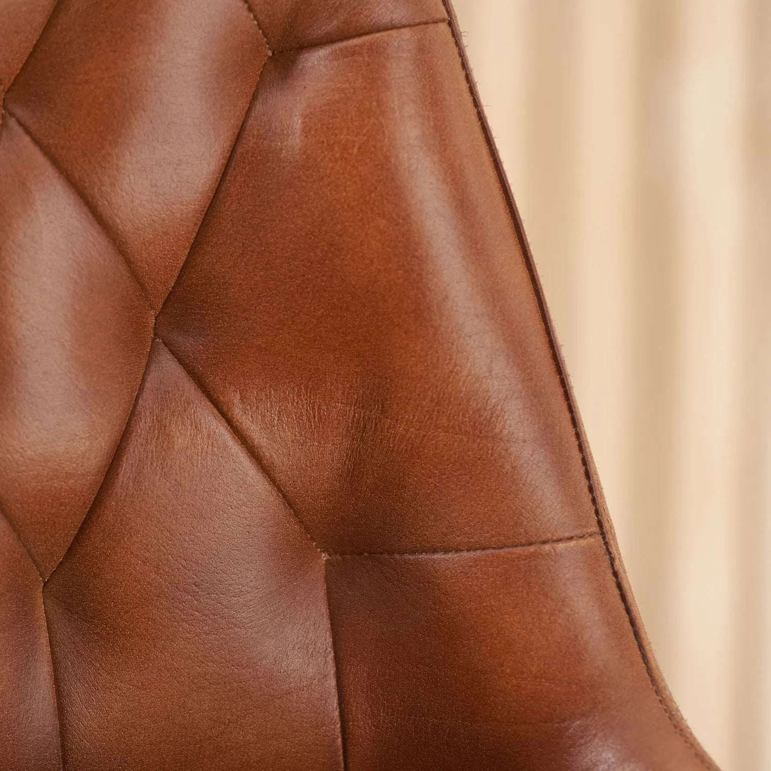 Vintage brown genuine leather dining chair with hand stitched diamond back and black metal sled-style legs – industrial upholstered dining chair by Click Style