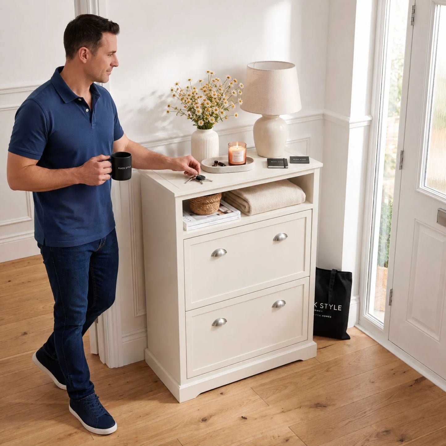 Warm Ivory Pine Wood 2 Drawer Shoe Storage Unit with Silver Cup Handles styled in a hallway with a man grabbing keys 106x80x28cm | Click Style