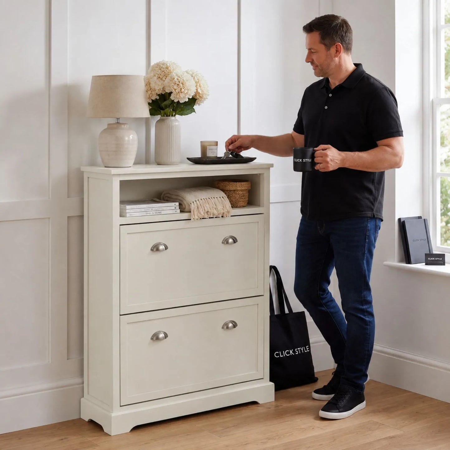 Warm Ivory Pine Wood 2 Drawer Shoe Storage Unit with Silver Cup Handles styled in a modern neutral hallway with a man 106x80x28cm | Click Style