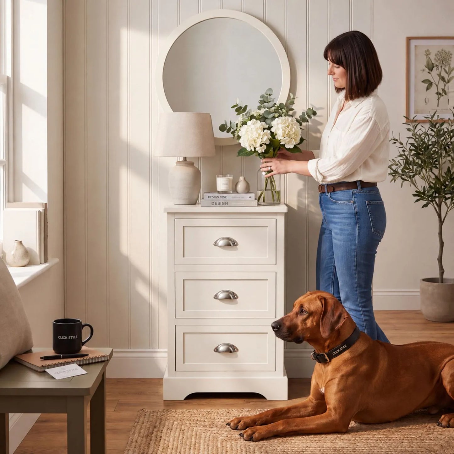 Warm Ivory Pine Wood 3 Drawer Chest of Drawers with Polished Silver Cup Handles styled in a modern country home with a woman arranging flowers 70x41x33cm | Click Style