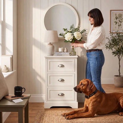 Warm Ivory Pine Wood 3 Drawer Chest of Drawers with Polished Silver Cup Handles styled in a modern country home with a woman arranging flowers 70x41x33cm | Click Style