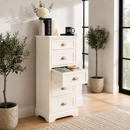 Warm Ivory Pine Wood 5 Drawer Tall Boy Chest of Drawers with Polished Silver Cup Handles styled in a modern home with open drawer showing storage | Click Style