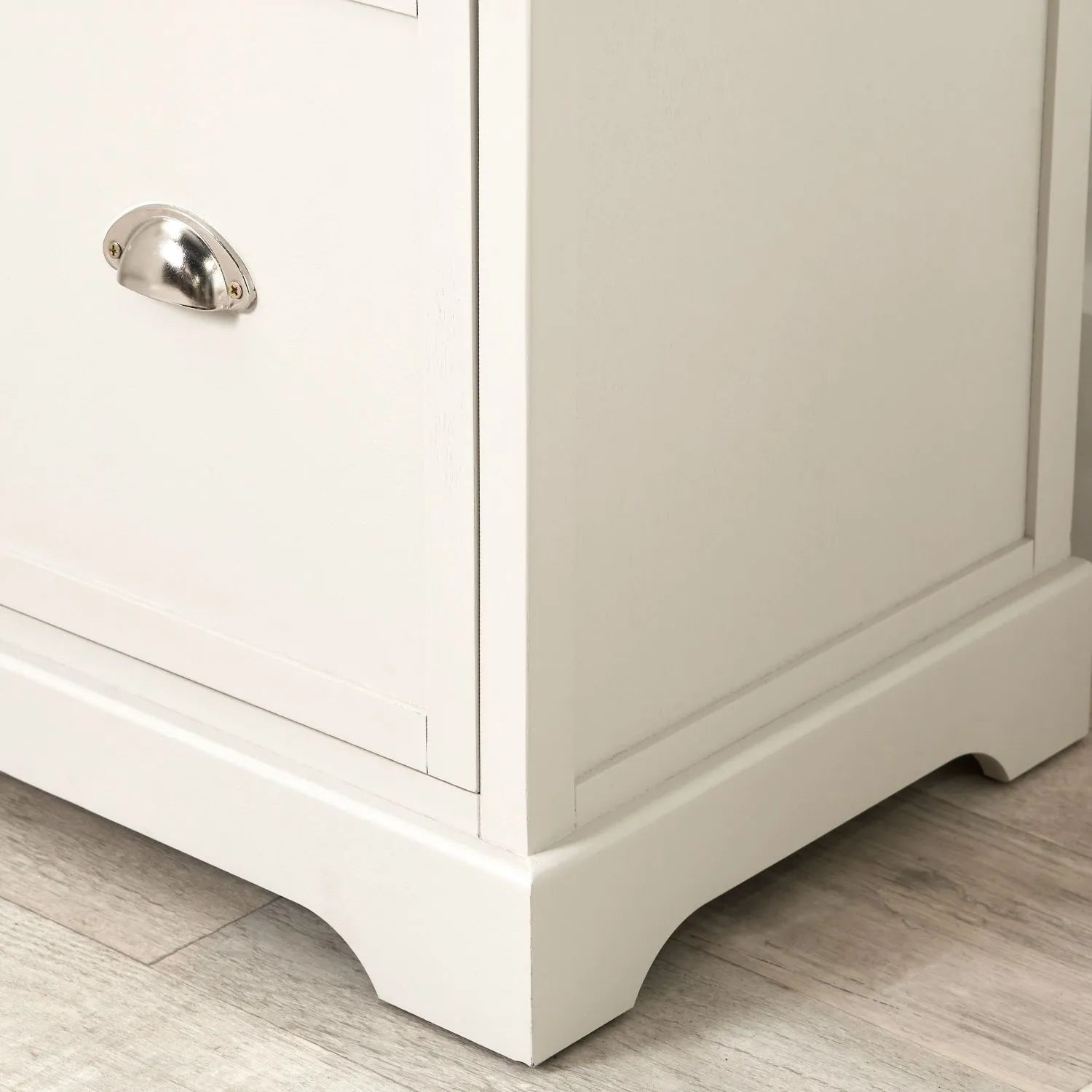 Warm Ivory Pine Wood 5 Drawer Tall Boy Chest of Drawers with Polished Silver Cup Handles close-up of bottom right, handle and plinth 108x41x33cm | Click Style